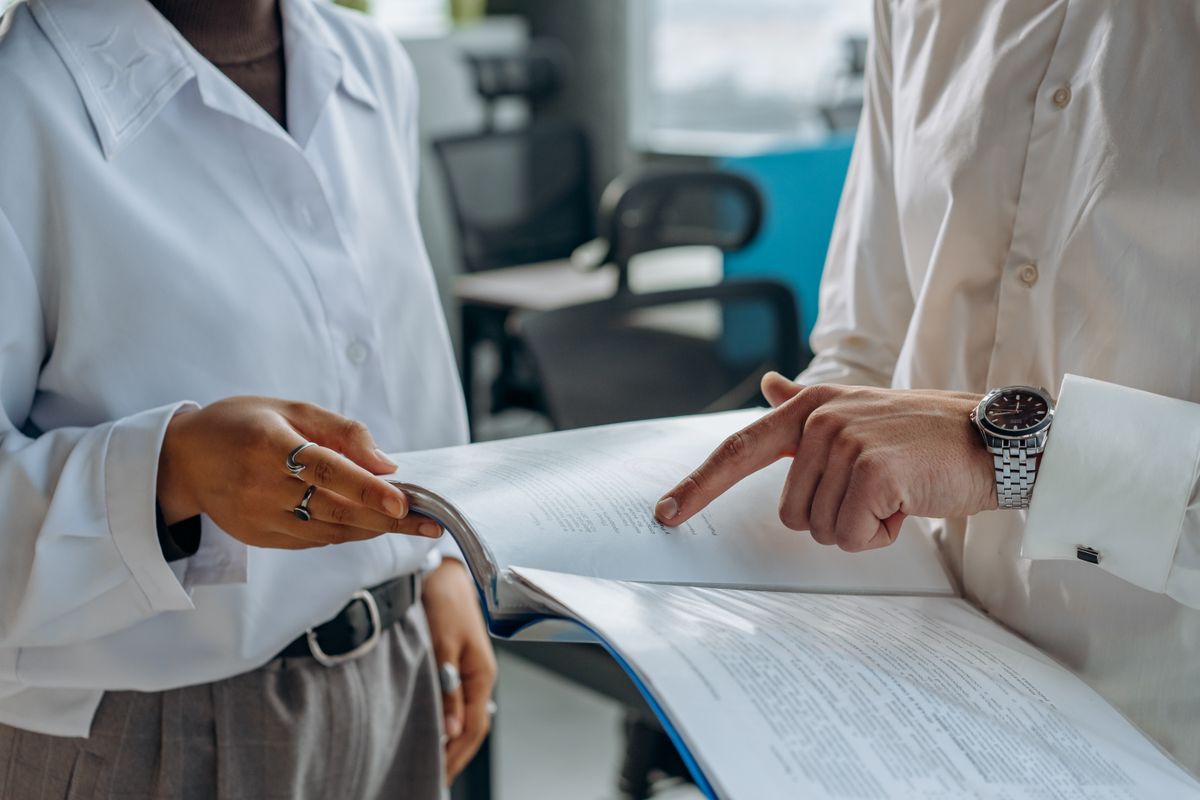 Executives reviewing governance and risk documents