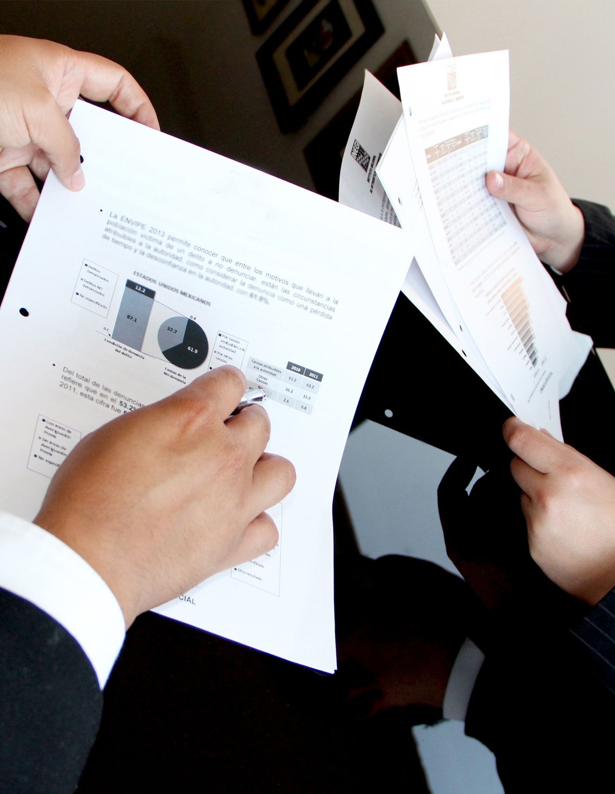 Compliance documents being reviewed at a desk